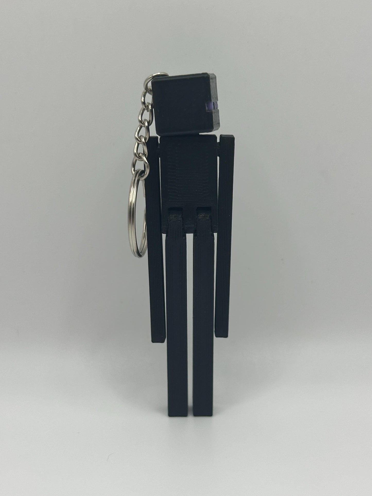 Articulated VoidMan Figure – 3D Printed Toy | Poseable pixel-Inspired Keychain Option