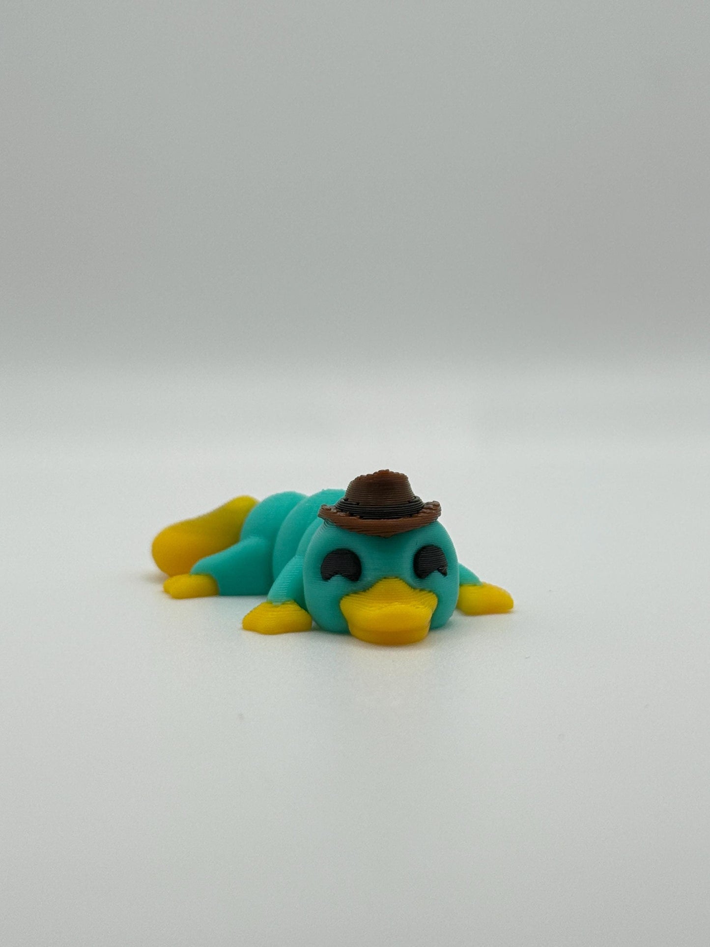 3D Printed Mini Articulated Animal Fidget Toy: Saber3D Design