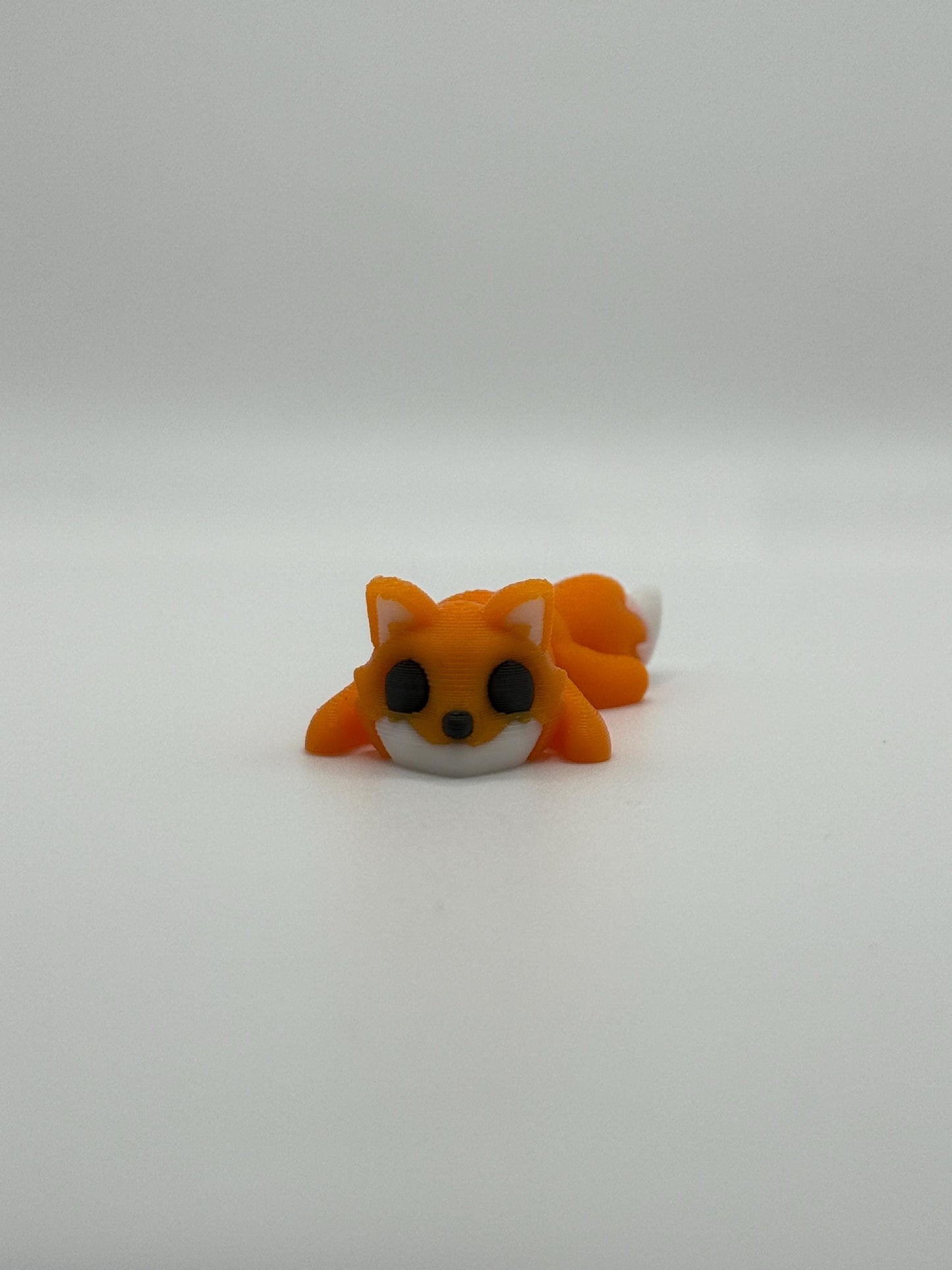 3D Printed Mini Articulated Animal Fidget Toy: Saber3D Design