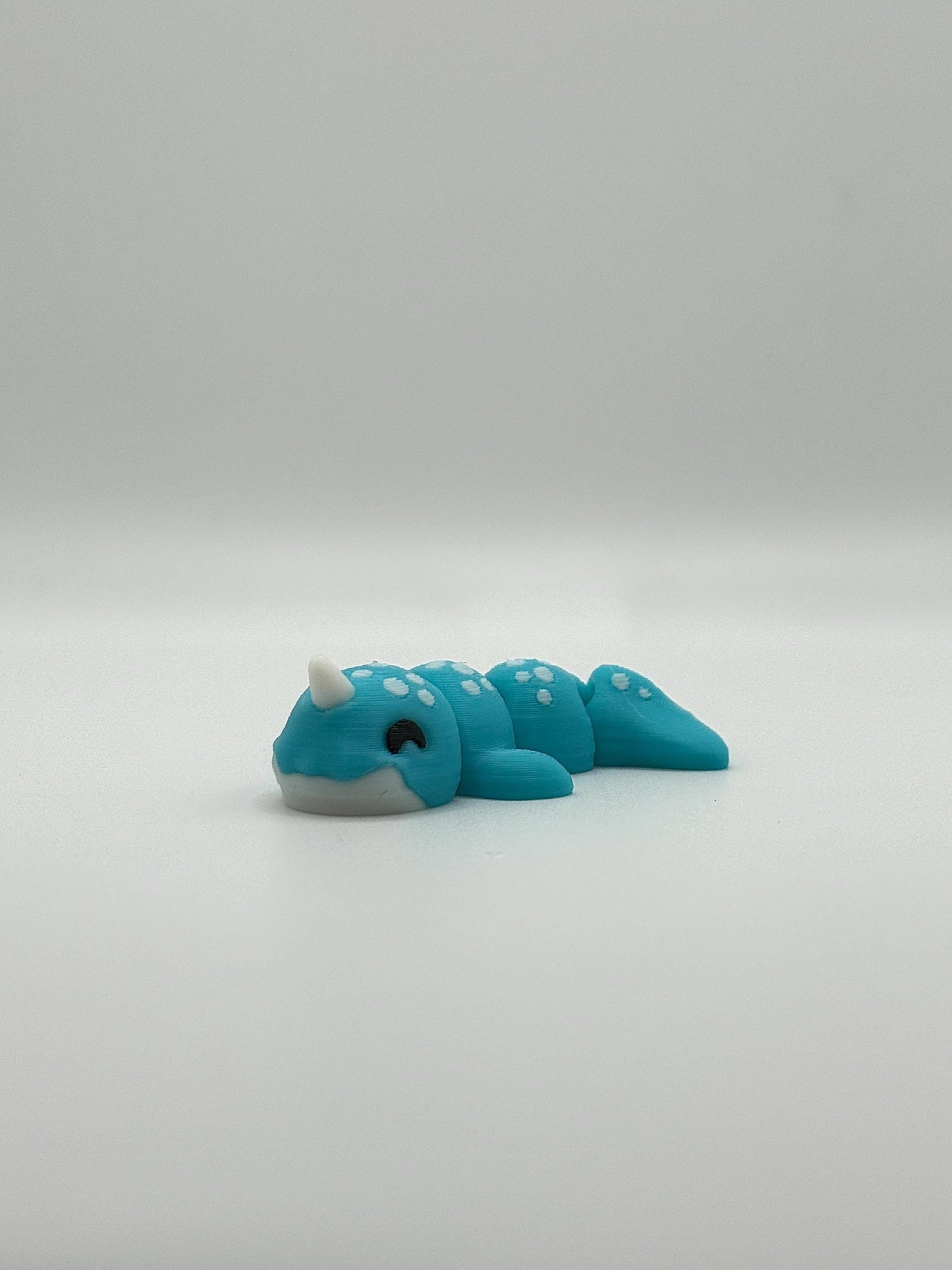3D Printed Mini Articulated Animal Fidget Toy: Saber3D Design