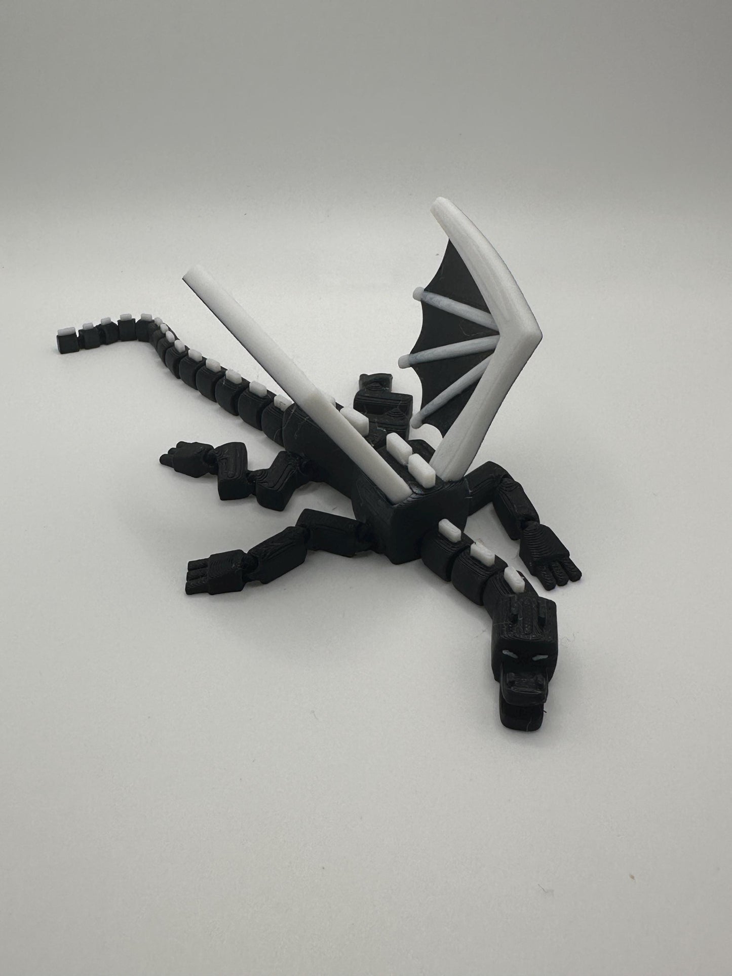 Articulated Dragon Figurine: Black & White 3D Printed Model