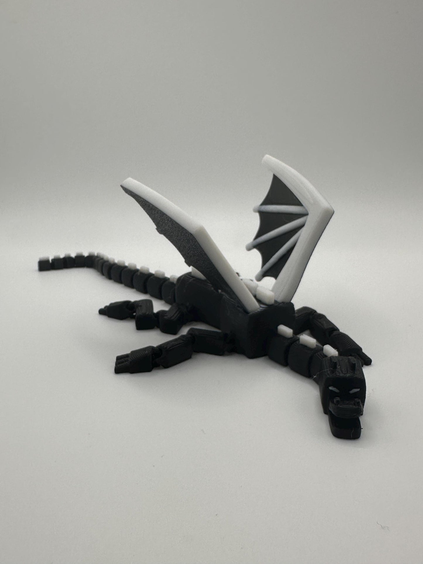 Articulated Dragon Figurine: Black & White 3D Printed Model