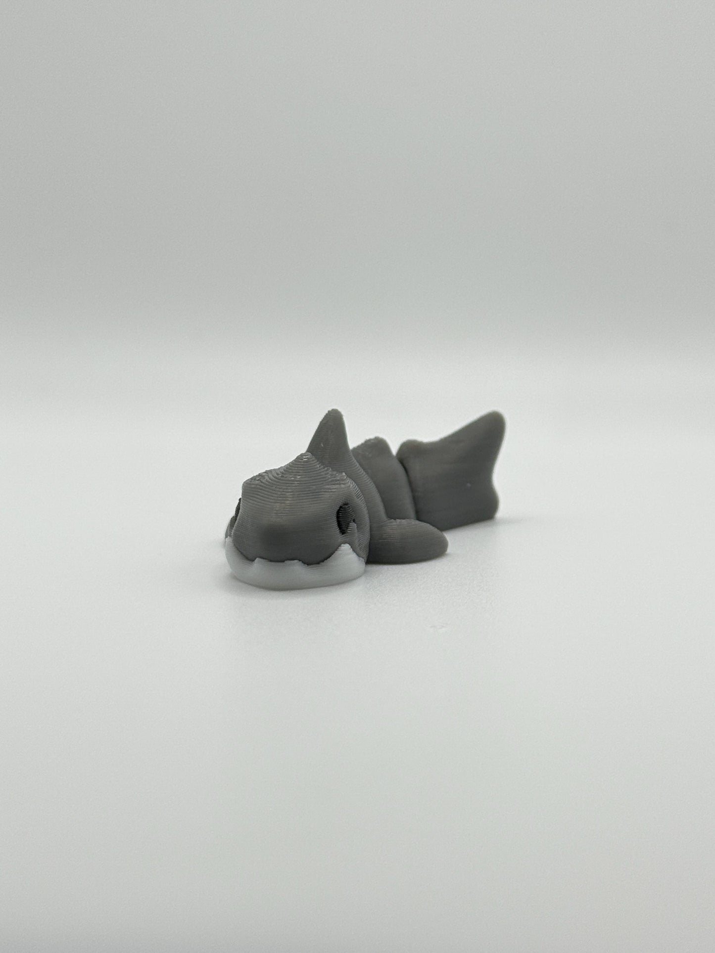 3D Printed Mini Articulated Animal Fidget Toy: Saber3D Design