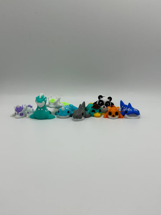 3D Printed Mini Articulated Animal Fidget Toy: Saber3D Design